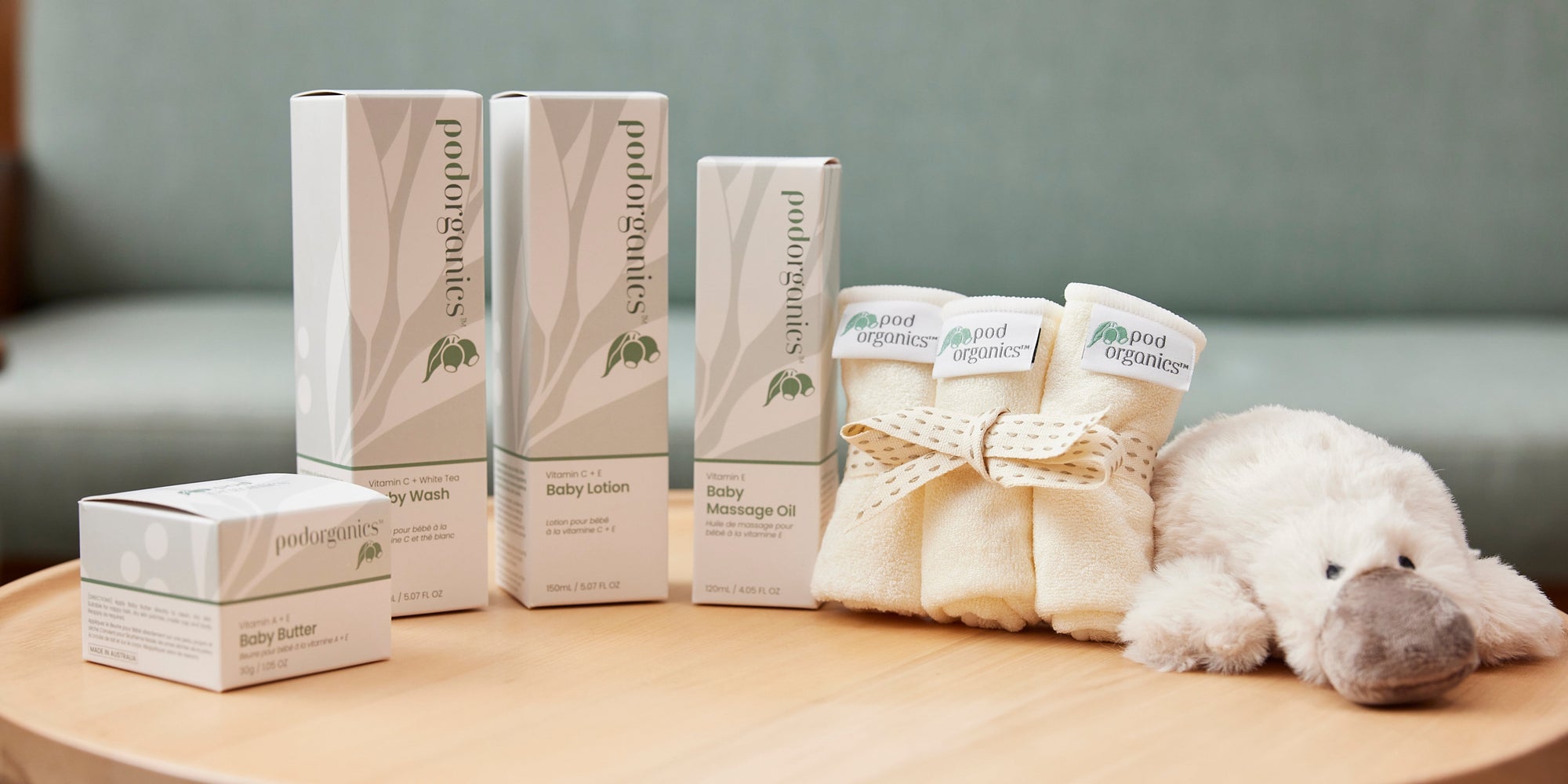 pod organics product shot baby butter wash lotion massage oil cloths and platypus