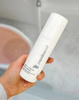 Mum using Pod Organics Baby Wash during a gentle newborn bath