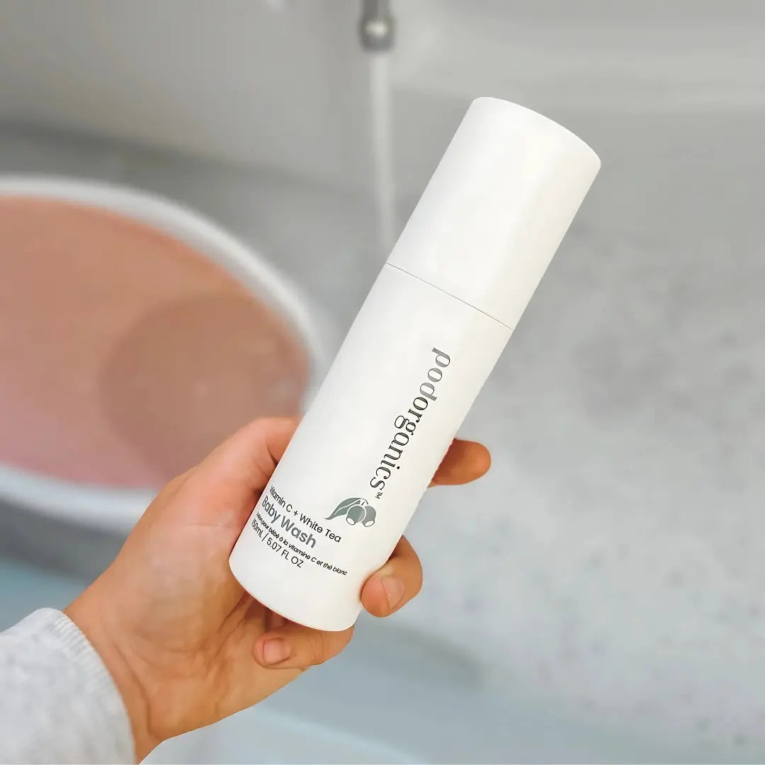 Mum using Pod Organics Baby Wash during a gentle newborn bath